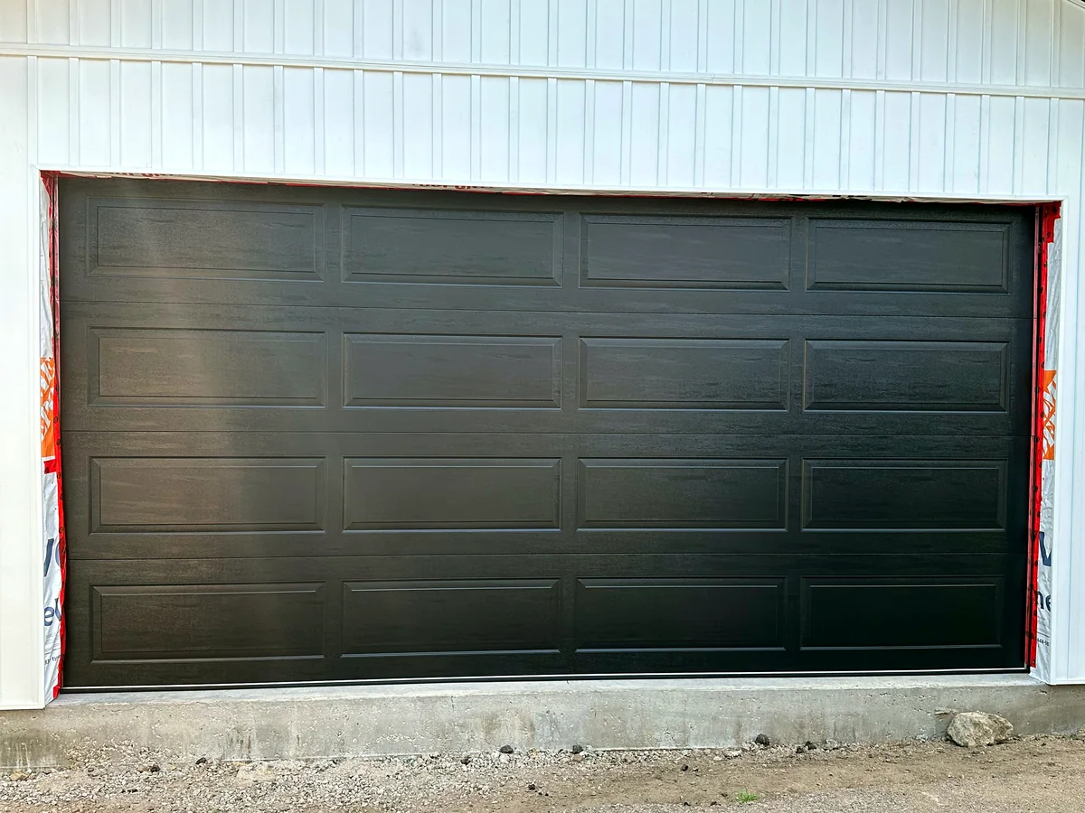Black double-width sectional garage door
