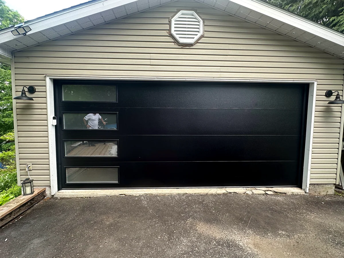Black contemporary garage door with offset windows